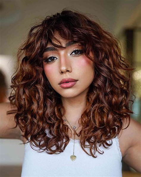 mid length wavy hair with bangs|bangs for frizzy wavy hair.